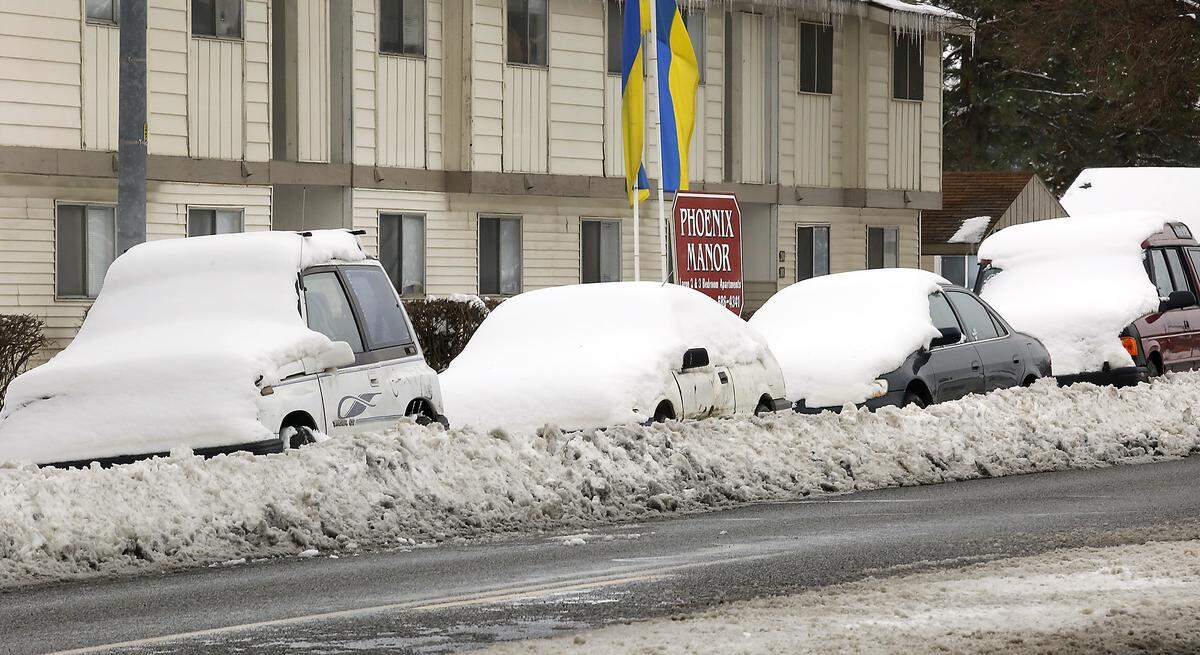 Vehicles parked near the Phoenix Manor Apartments in the 500 block of South Olympia Street in Kennewick seemed destined to remain place until the snow thaws or a rigorous shovel session.