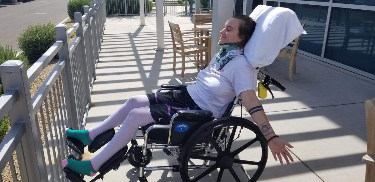 Danika Whitsett wheeled herself outside Friday morning to soak up some sunshine at the Colbalt Rehabilitation Hospital in Surprise, Ariz.