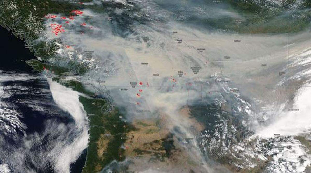 A satellite image from Saturday is marked with where fires are burning north and northwest of the Tri-Cities.