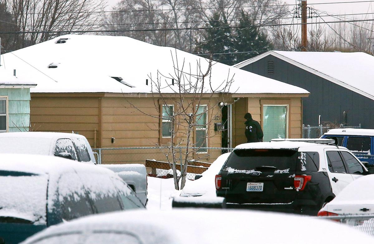 Police officers walk into a home in the 1800 block of North 11th Avenue in Pasco Friday morning following the resolution of a standoff with an armed suspect. The Tri-City Regional SWAT team responded after Pasco officers patrolling the neighborhood heard gun shots around 4 a.m. and observed a male holding a rifle in the doorway of a home before he barricaded himself inside the house. Three males later surrendered peacefully to officers, according to Sgt. Scott Warren of the Pasco Police Department. Watch a video at: tricityherald.com/video