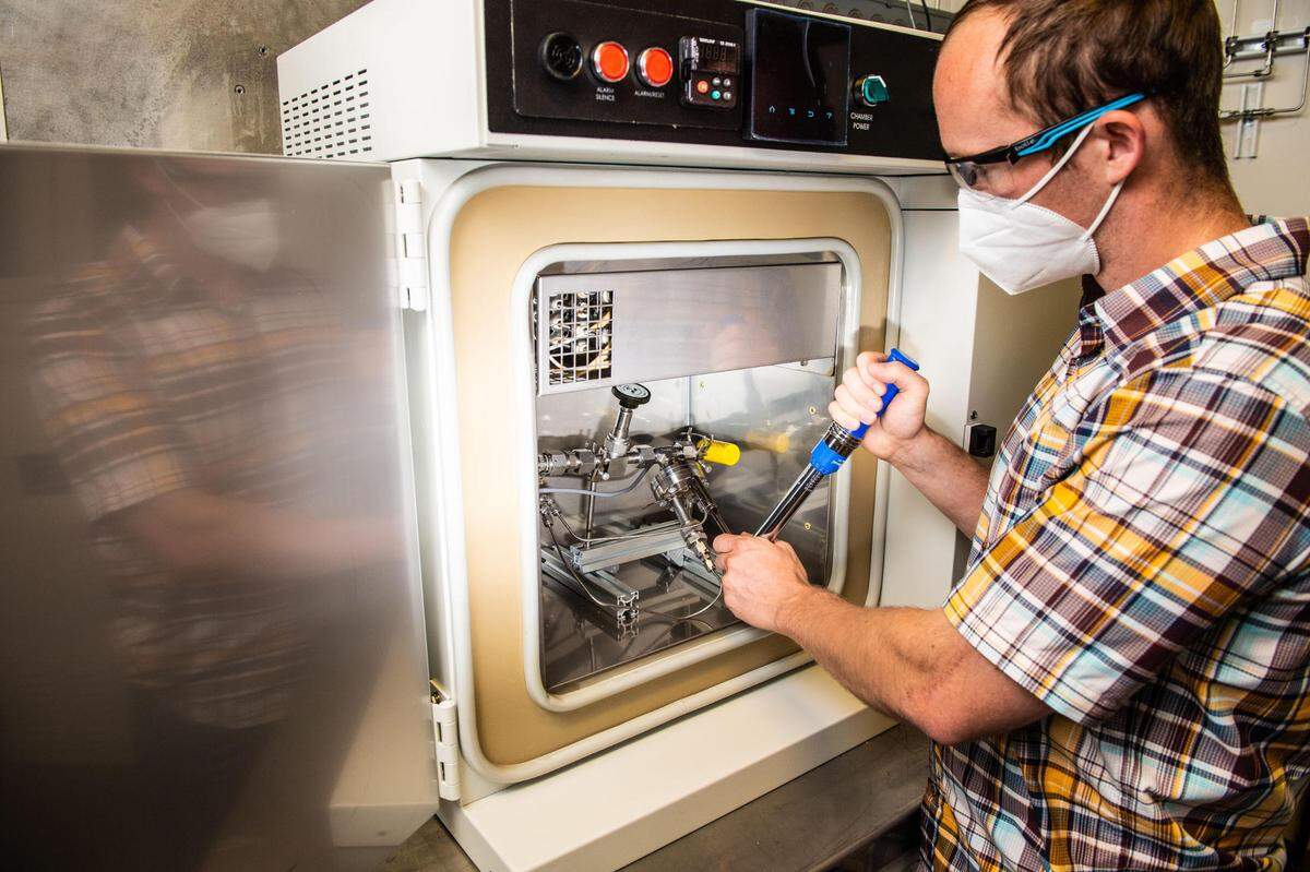 Mechanical engineer Dustin Clelland uses a unique capability at PNNL to look into how hydrogen moves through polymers such as rubber, which are often used as liners in storage tanks, seals and valves in transport and refueling stations in hydrogen infrastructure.