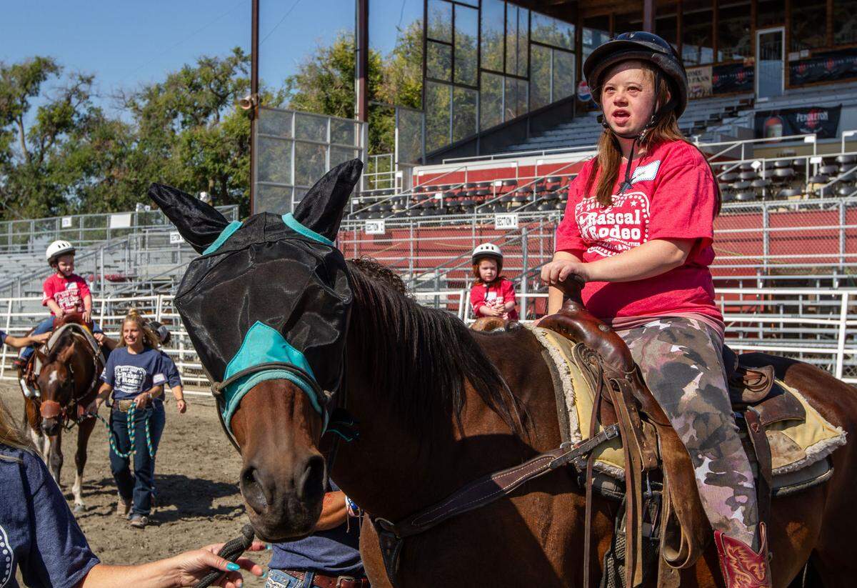 Kate Edvalson, 24, of Richland, rides a horse during the annual Rascal Rodeo at the Benton Franklin Fair & Rodeo. Edvalson said her favorite rodeo event was the barrel racing.