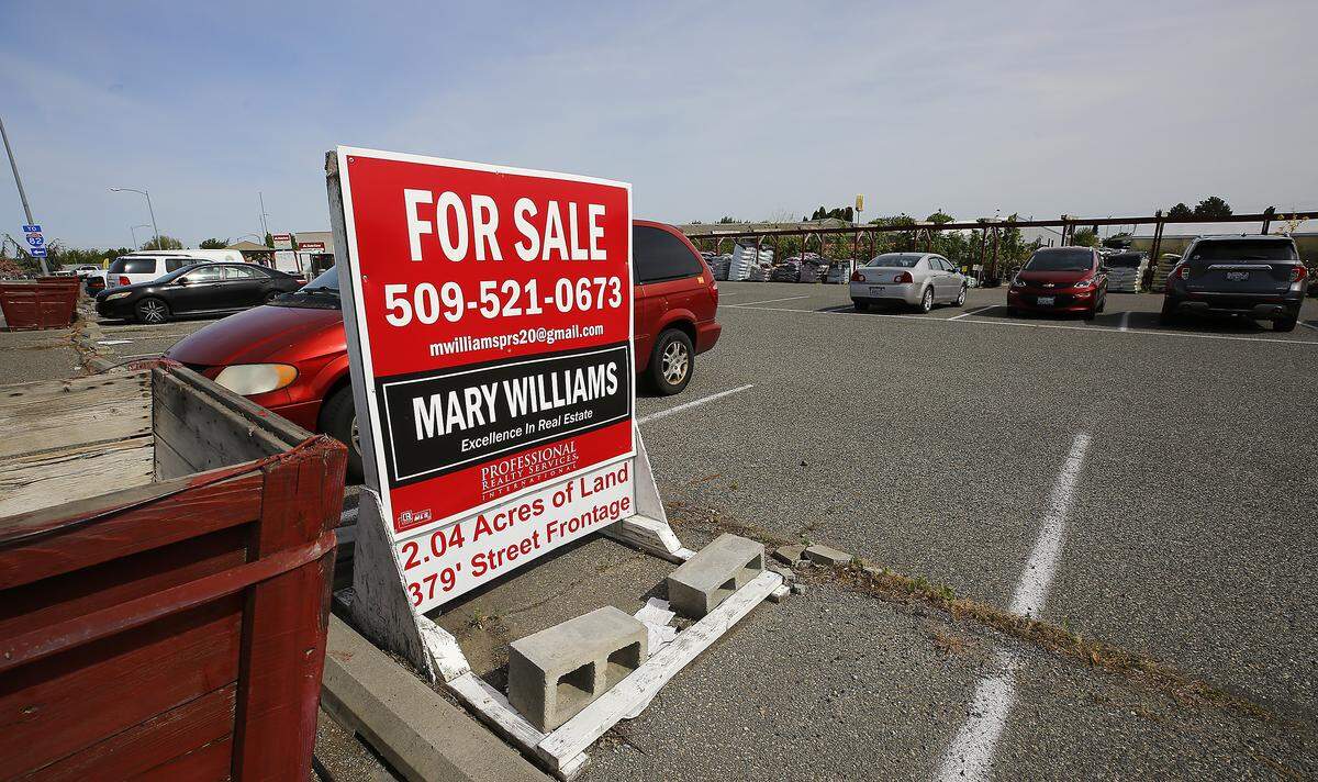 A for sale sign sits in the parking lot at the Flower Farm at 311 S. Columbia Center Blvd. in Kennewick. 