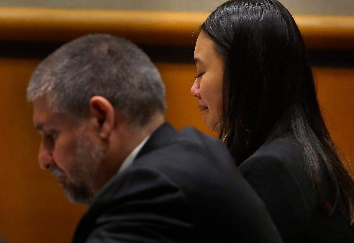Driver Jennifer Duong reacts to emotional statements presented in Benton County Superior Court before her sentencing for the deaths of three friends when she was racing and crashed into light pole on George Washington Way in Richland.