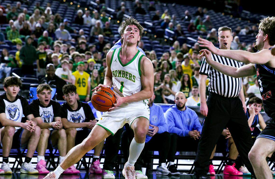 Richland’s Landen Northrop (1) drives toward the basket against West Valley during the WIAA Class 4A boys state basketball quarterfinals Thursday, March 5, 2026, at the Tacoma Dome in Tacoma. Northrop scored a game-high 33 points as Richland defeated West Valley 76-62 to advance to the semifinals.