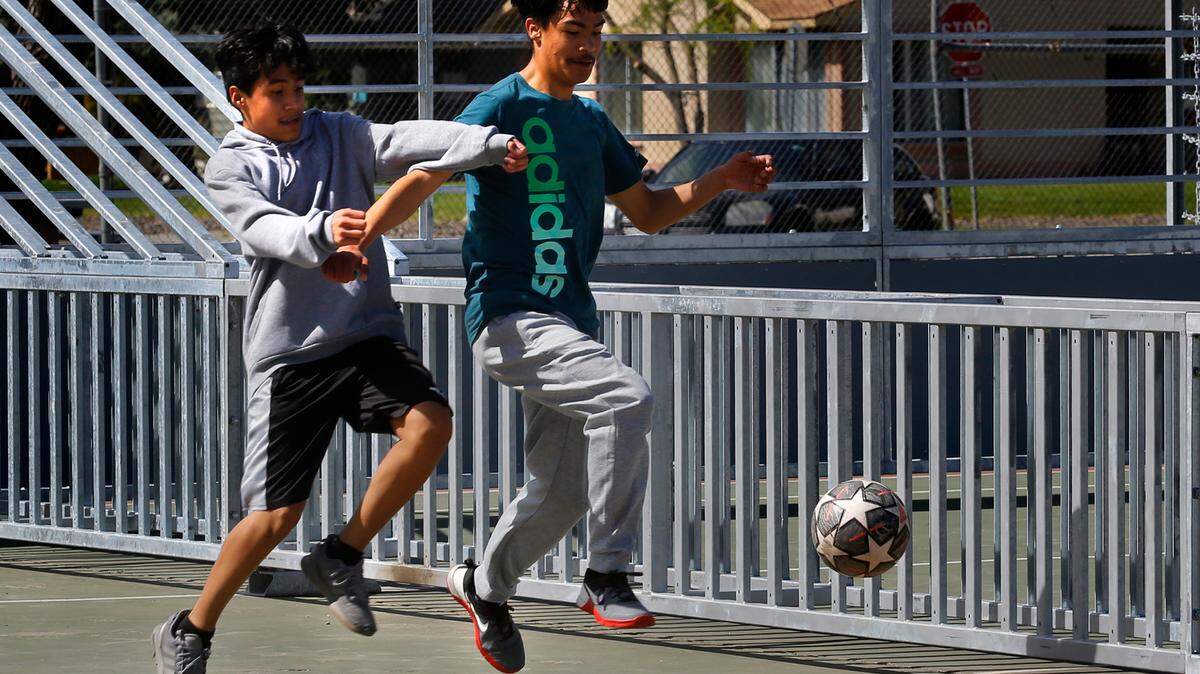 Pasco plans a new sports complex with 10 athletic fields for soccer, lacrosse, rugby and Frisbee. Here two Pasco students Alex Lira, left, and Miguel Jimenez play on a mini-pitch soccer court at Sylvester Park. 