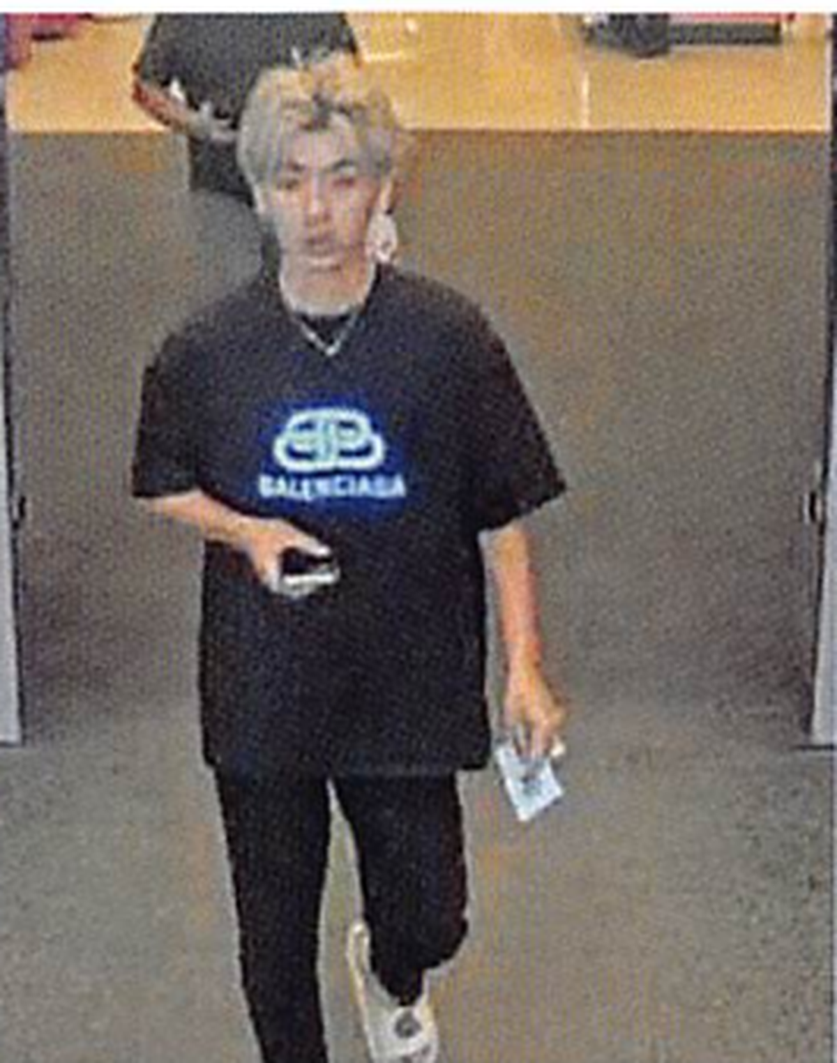 Zhangbo Liang leaves the Target store in Richland after allegedly receiving refunds for counterfeit iPads on June 21, 2024.