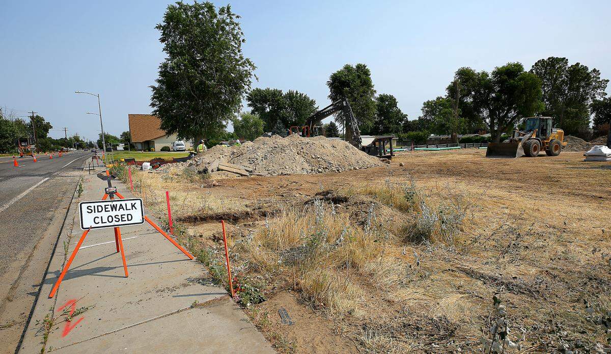 Construction crews are connecting sewer lines for a new housing subdivision in a vacant lot at 5117 W. Seventh at South Edison Street in Kennewick.