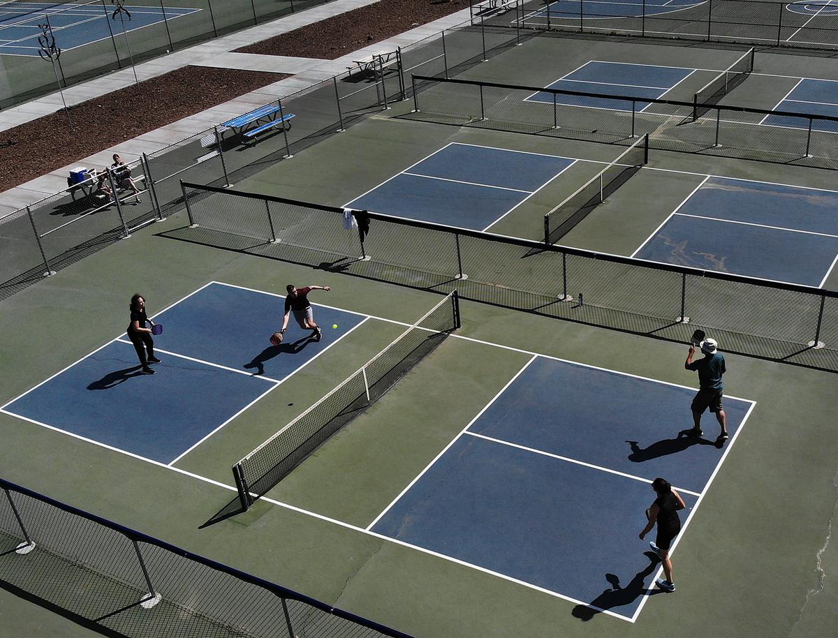 Mixed doubles play pickleball on a recent weekday morning at the courts in Lawrence Scott Park. The Kennewick Council approved $1.3 million for pickleball courts there, restrooms and a gathering shelter.