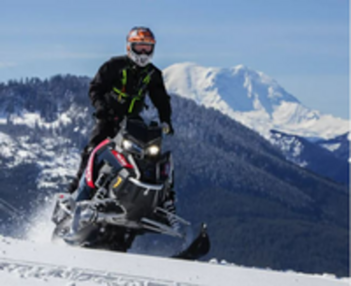 A snowmobiler powers through powder at a Washington Sno-Park. Washington State Parks announced Friday that it will not open 14 motorized Sno-Parks this winter.