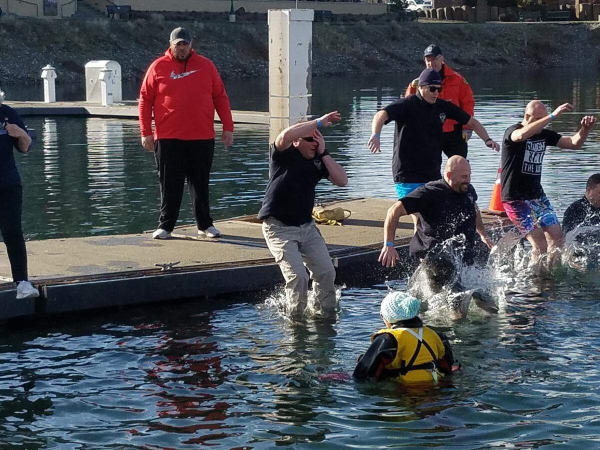 Hundreds jumped into the Columbia River at Richland’s Columbia Point Marina Park on Saturday for the annual fundraiser for the Special Olympics of Washington. They had raised $120,000 in pledges by Saturday.