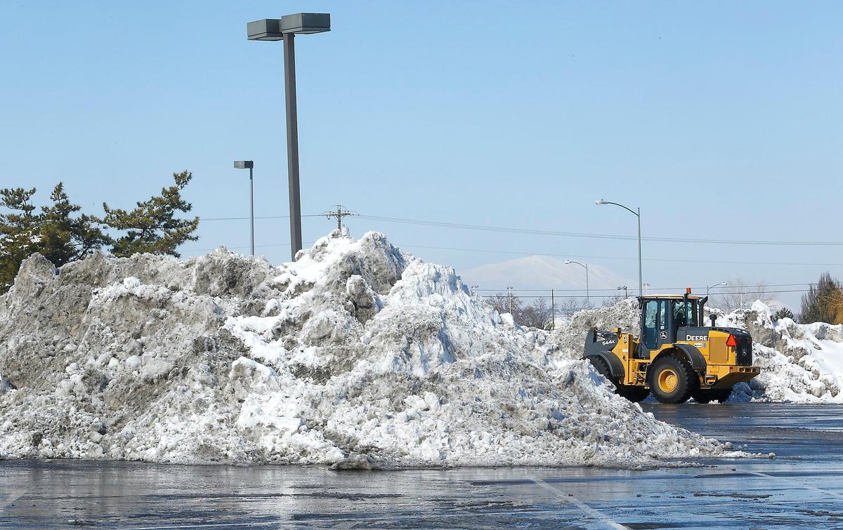 Mounds of snow removed by heavy equipment fill parking spaces recently at the Tri-Cities Center strip mall in the 7500 West Canal Drive in Kennewick. Many businesses and residents are running out of options for where to pile the snow from the recent repeated snowstorms.