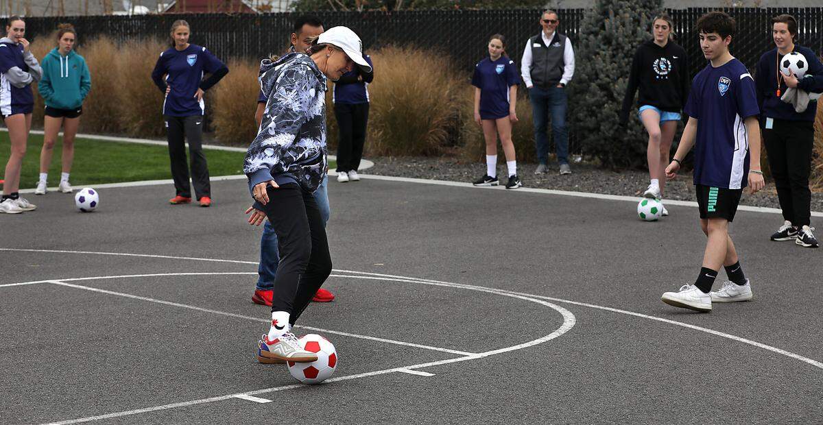 Brandi Chastain, two-time Olympic gold medalist and FIFA Women’s World Cup champion, demonstrated a passing drill at a soccer skills clinic she conducted during her visit Friday at the Boys & Girls Club of Benton and Franklin Counties site in Kennewick. Chastain was in the Tri-Cities for the Boys & Girls Club’s annual fundraising event Dinner with Friends, which was held the Three Rivers Convention Center Friday evening. Several dozen local youth participated in the skills clinic.