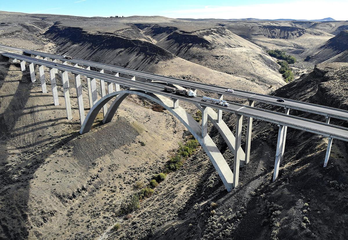 The Fred G. Redmon Memorial Bridge is a twin arch bridge that carries Interstate 82 traffic across Selah Creek near Selah, between Yakima and Ellensburg. The dry canyon is 325 feet below.