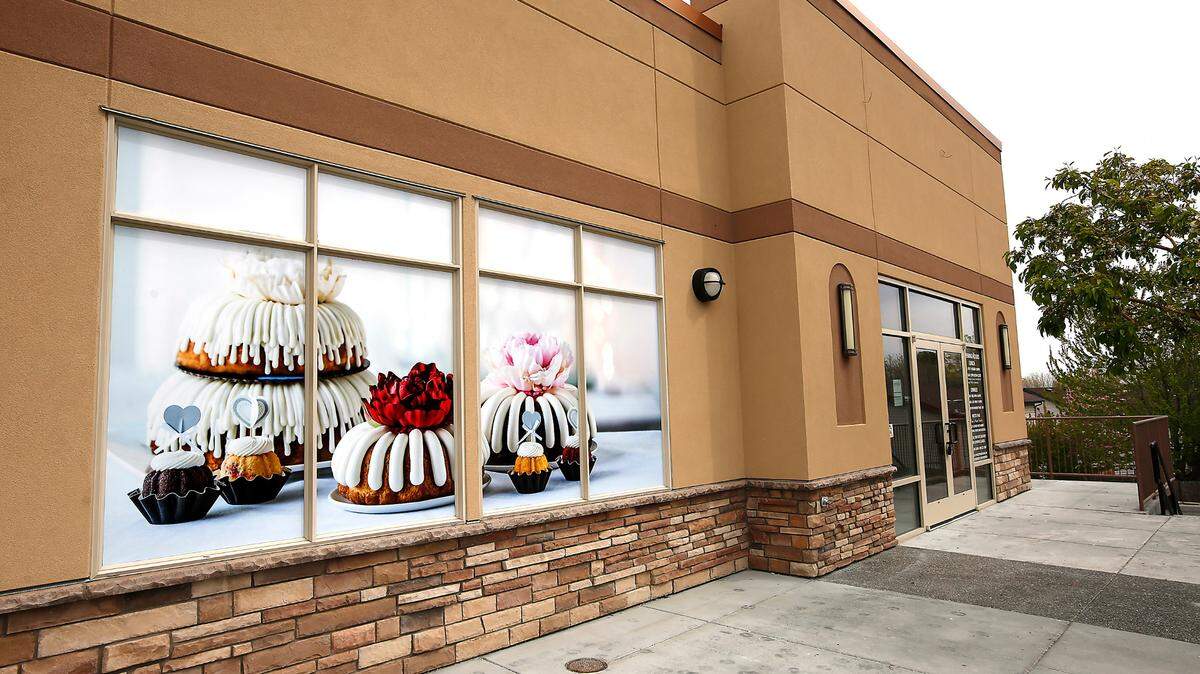 A advertising graphic showing Bundt cake desserts has been attached to windows at 110 Gage Boulevard in Richland for a new Nothing Bundt Cakes location in the former Mezzo Thai restaurant site.