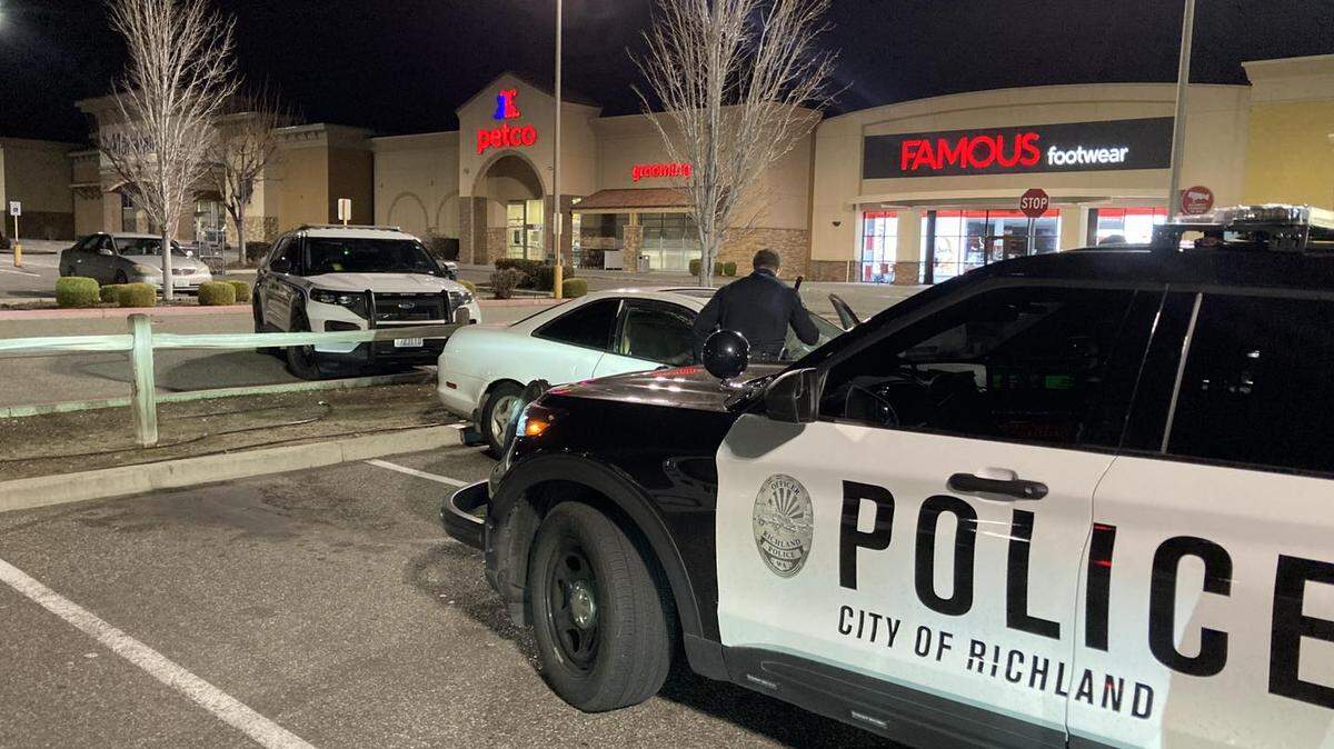A Tri-Cities man was arrested after being found in a car unconscious with an infant in the back seat.