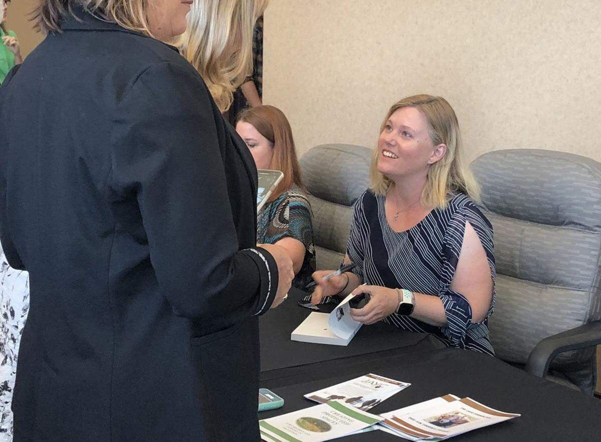 Jaycee Dugard signs copies of her books, “A Stolen Life: A Memoir” and “Freedom: My Book of Firsts” in Yakima after speaking at a United Way breakfast. She spoke in Kennewick at a Kadlec Foundation fundraiser at noon.