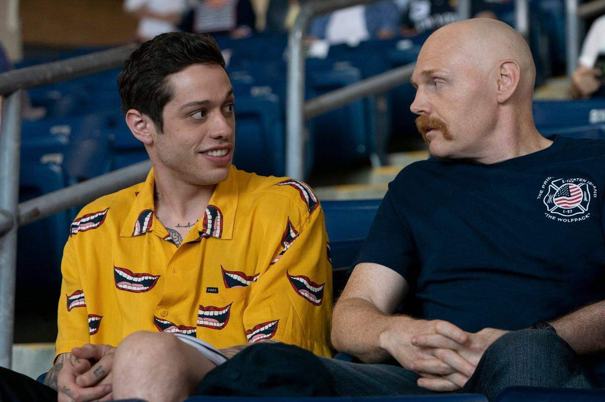 In this image released by Universal Pictures, Pete Davidson, left, and Bill Burr appear in a scene from “The King of Staten Island,” directed by Judd Apatow.