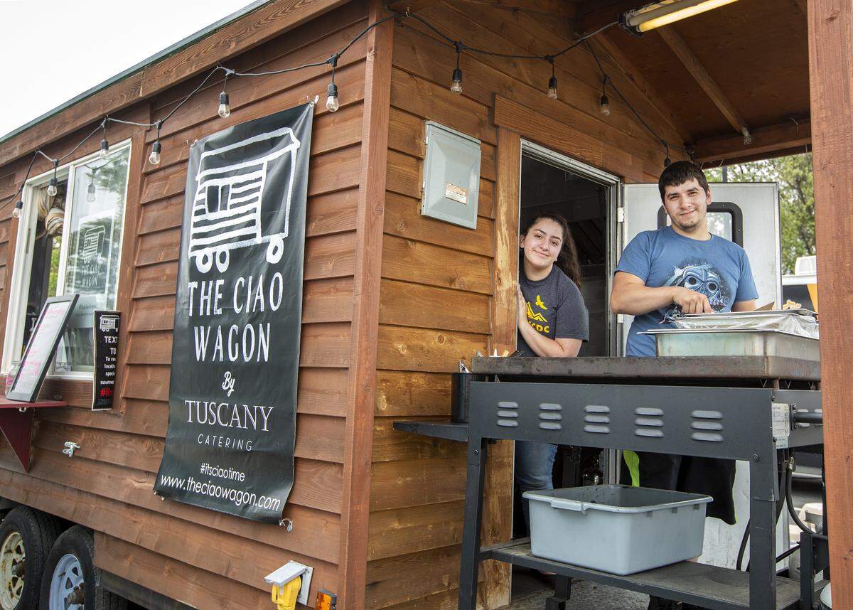 Siblings Sophie and Jacob Ayala work inside the Ciao Wagon for their parents Susanne and Jessie Ayala owners of the food truck. Ciao Wagon is the latest food truck to join the Port of Kennewick’s Columbia Gardens.
