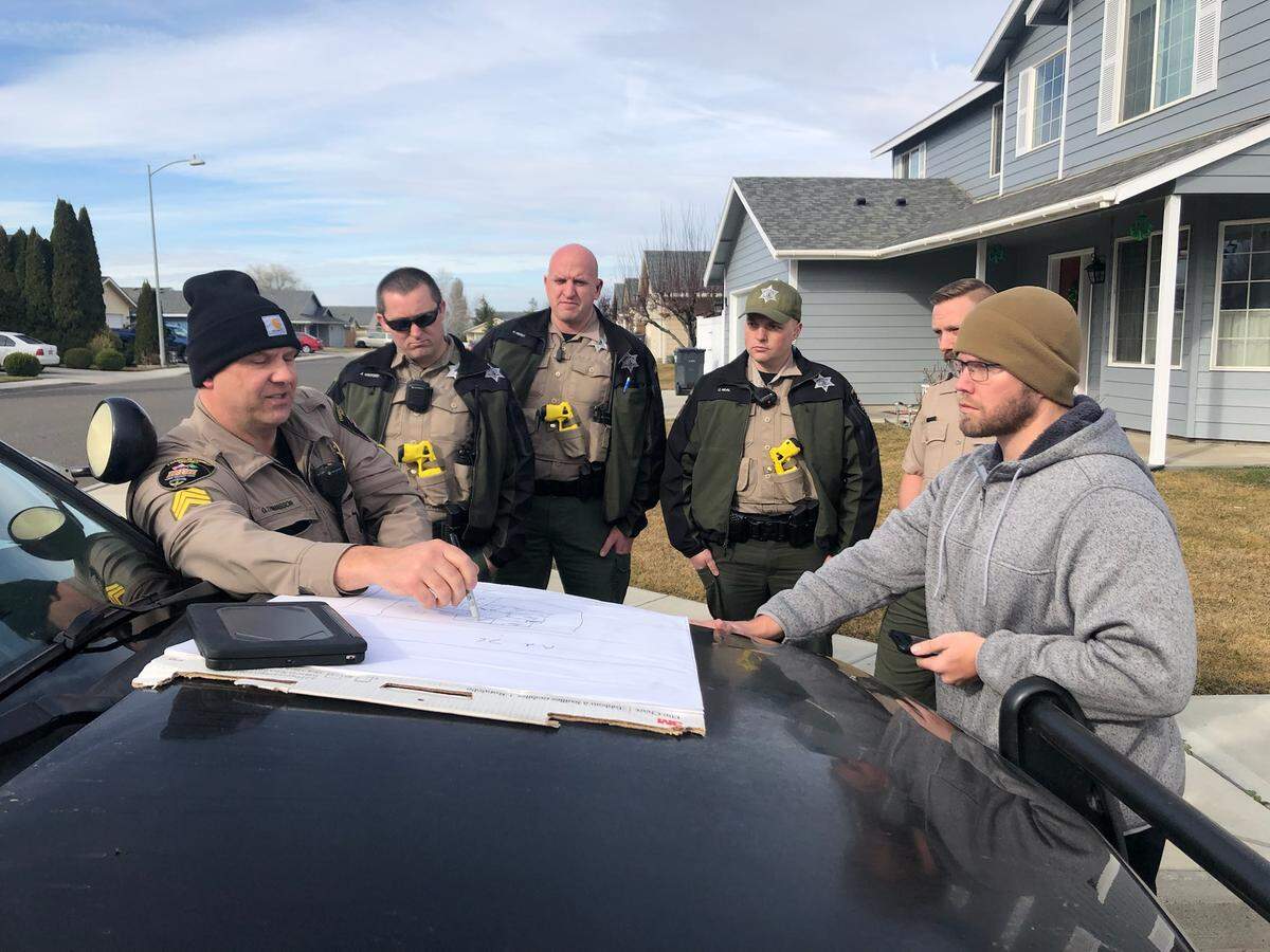 Franklin County sheriff’s deputies met with landlord Bryant Scott, right, on March 5, 2021, before going inside his Texada Lane home and forcibly removing tenant Aaron C. Kelly.