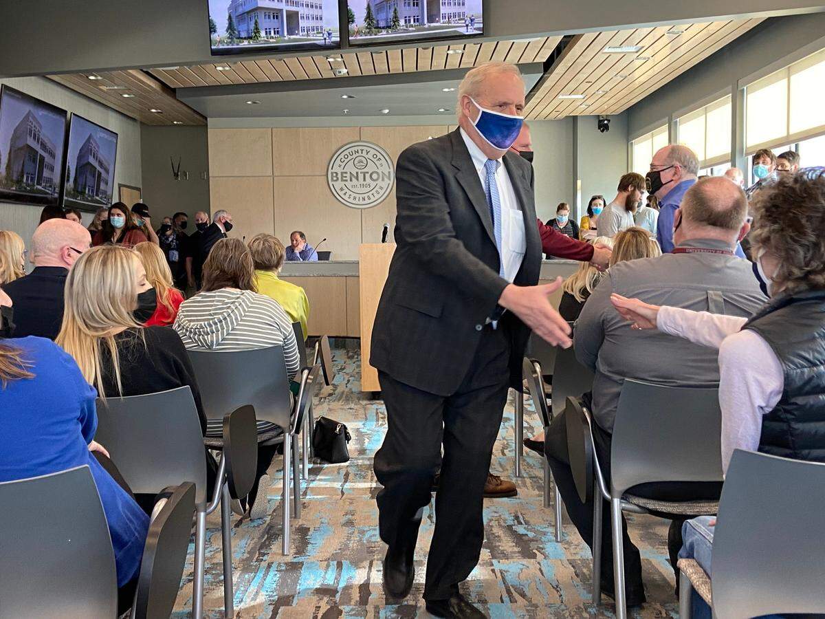 Benton County Prosecutor Andy Miller greeted people Tuesday before announcing his retirement after 36 years.