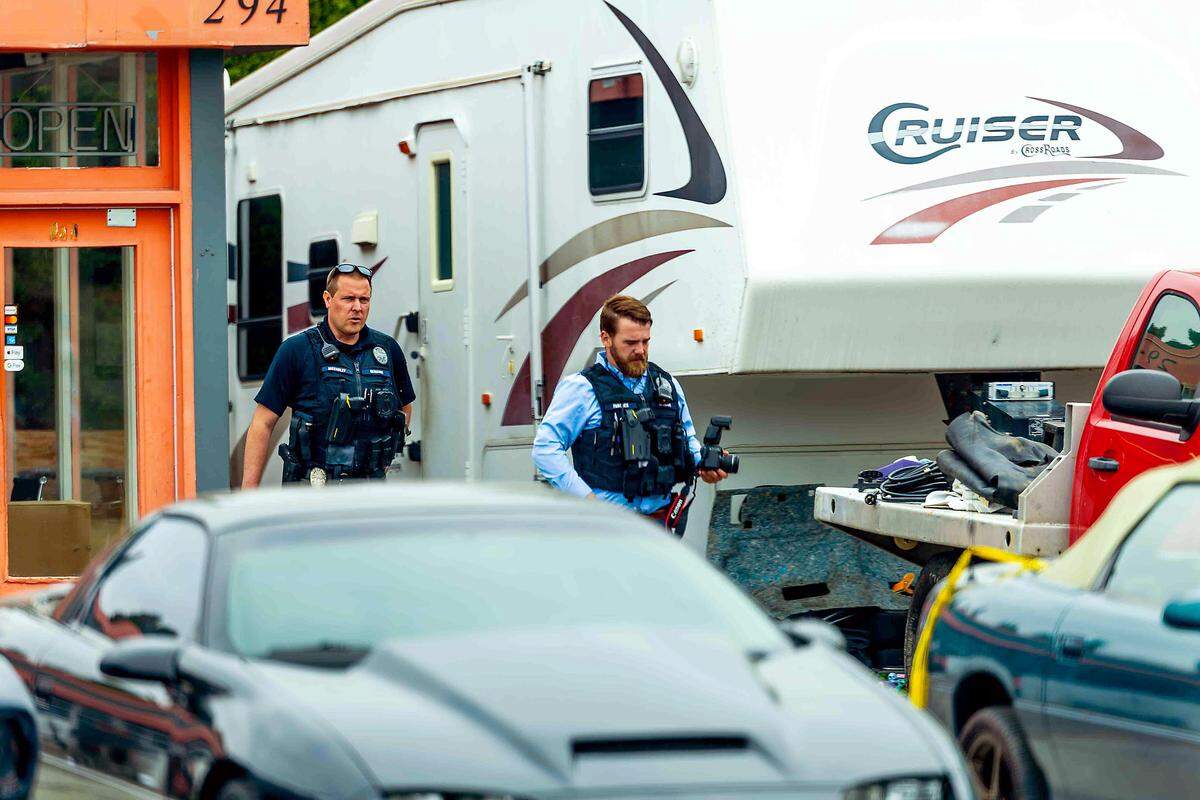 Richland police officers are investigating after a person was hit by a truck at a Richland auto shop.