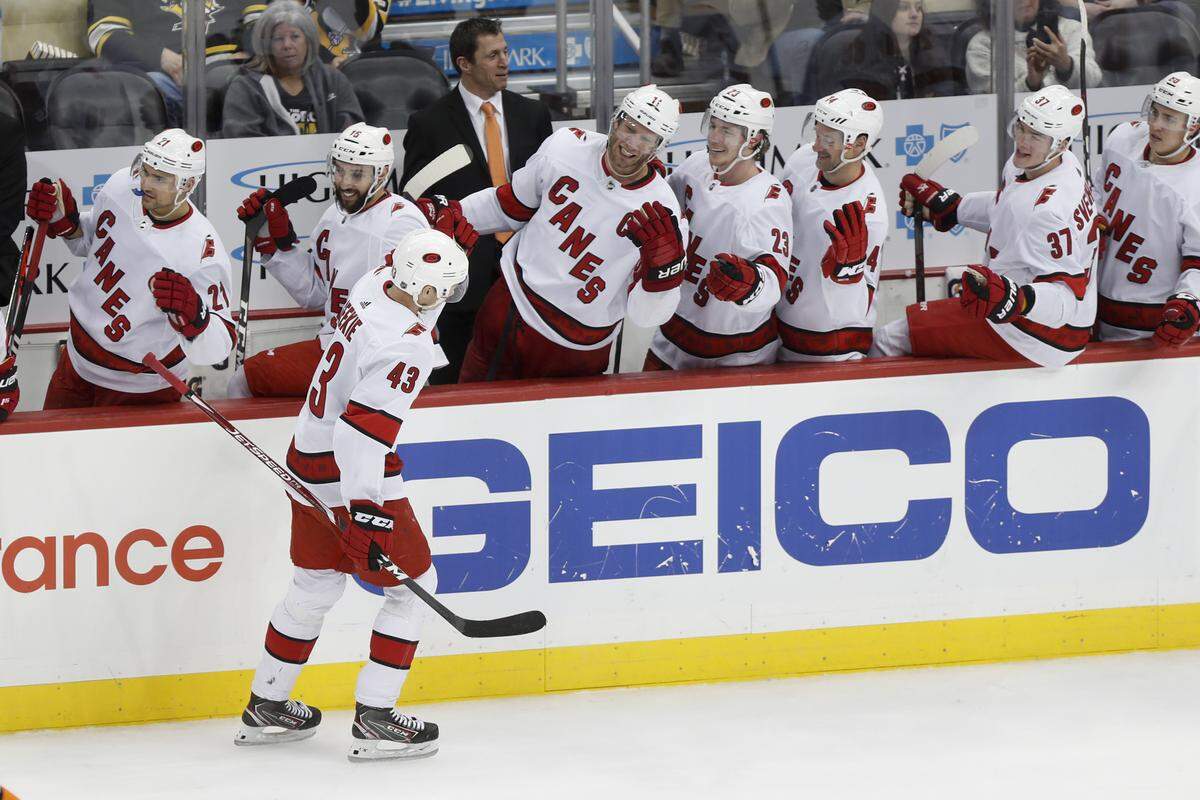 Carolina Hurricanes’ Morgan Geekie is greeted by teammates on the bench after scoring against the Pittsburgh Penguins during the third period of an NHL hockey game, Sunday, March 8, 2020, in Pittsburgh. The Hurricanes won 6-2. (AP Photo/Keith Srakocic)