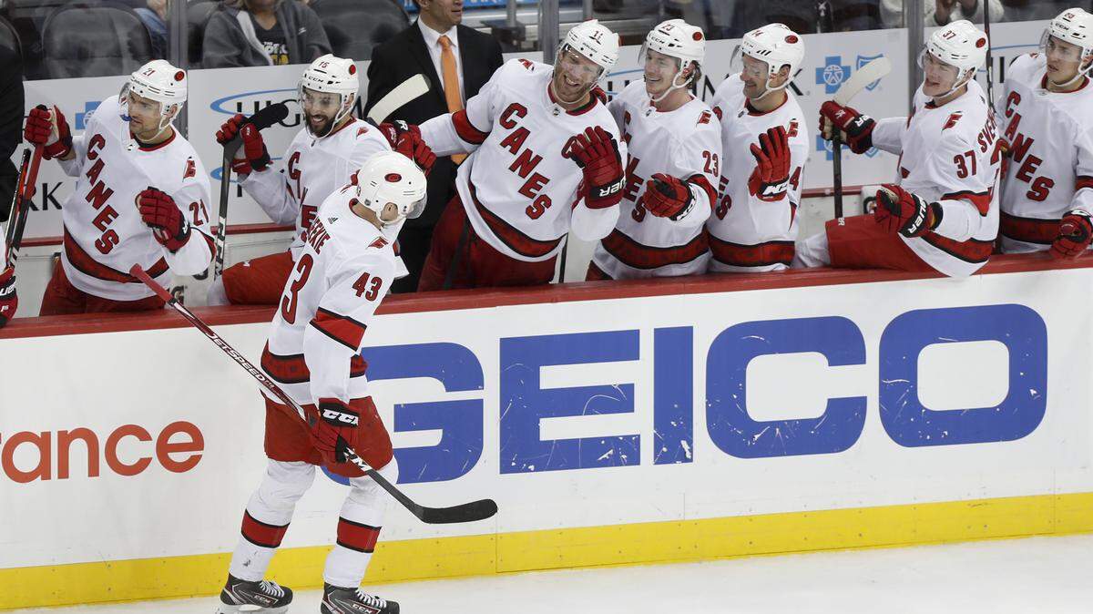 Carolina Hurricanes’ Morgan Geekie is greeted by teammates on the bench after scoring against the Pittsburgh Penguins during the third period of an NHL hockey game, Sunday, March 8, 2020, in Pittsburgh. The Hurricanes won 6-2. (AP Photo/Keith Srakocic)