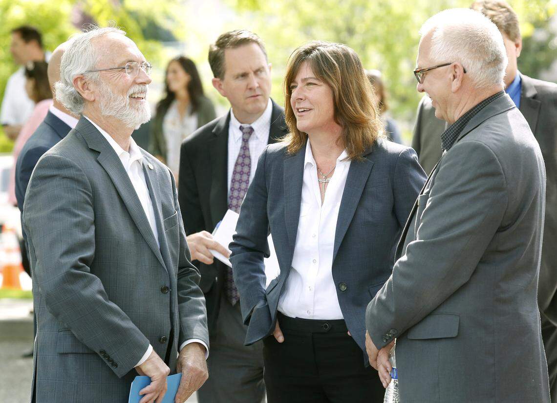 Anne White, DOE assistant secretary for environmental management, chatted with Rep. Dan Newhouse, R-Wash., left, at the dedication ceremony for the Hanford Workforce Engagement Center in Richland in May 2018.