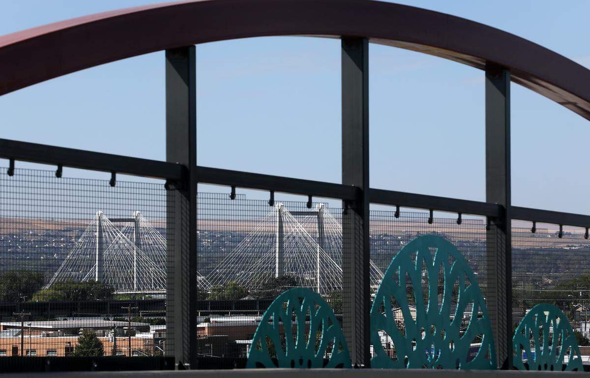 Cable bridge over the Columbia River framed through an arch on the Lewis Street Overpass in downtown Pasco.