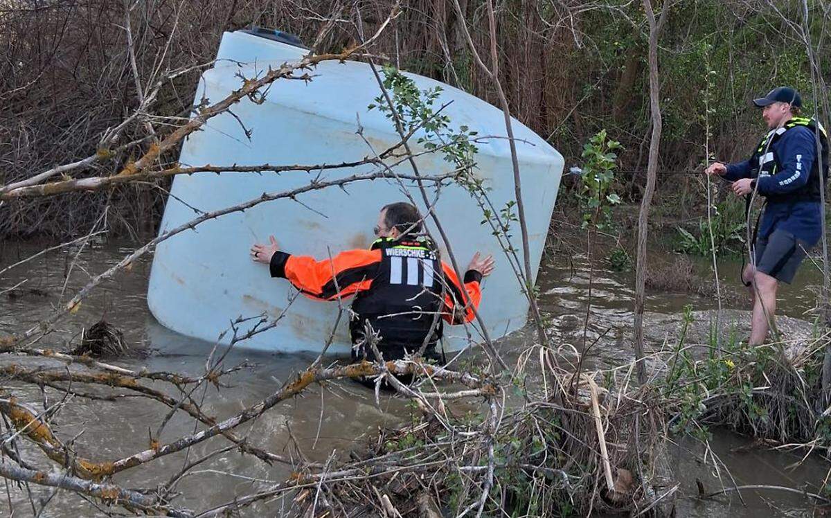 Members of Columbia Basin Dive Rescue teamed up with first responders from Benton County Fire District 2 to rescue goats that floated down the Yakima River in a modified tank during recent high water.