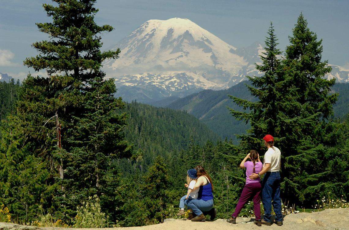 Visitors take in the view of Mount Rainier along the White Pass Scenic Byway.