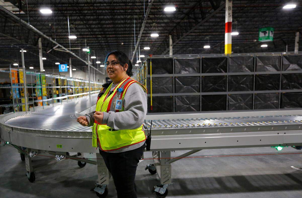 Site leader Erika Rocha conducts a visitor tour of the new Amazon delivery station in Pasco. The 87,000-square-foot facility sits on 20-acres services 30 Mid-Columbia zip codes and currently handles about 30,000 packages on a daily basis.