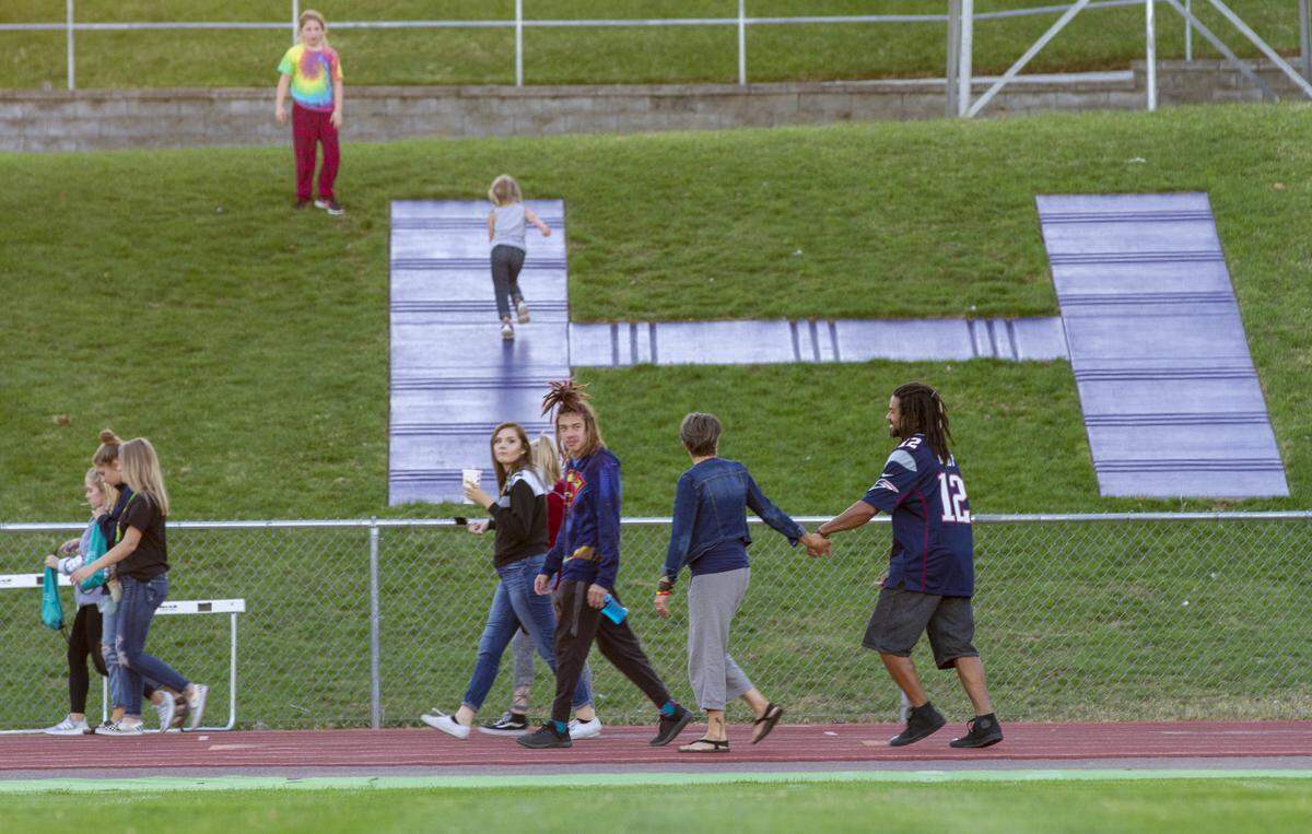 The Slack family walk around the track at Fran Rish Stadium during the third annual Strides to End Teen Suicide walk held by Hanford and Richland high schools. Students from all over Mid-Columbia were invited to participate in the walk, which is aimed at raising people’s awareness of youth suicide, remembering lost loved ones of suicides and reaching out to people who need support. If you or someone you know needs help call the Suicide Prevention Line at 1-800-273-8255.