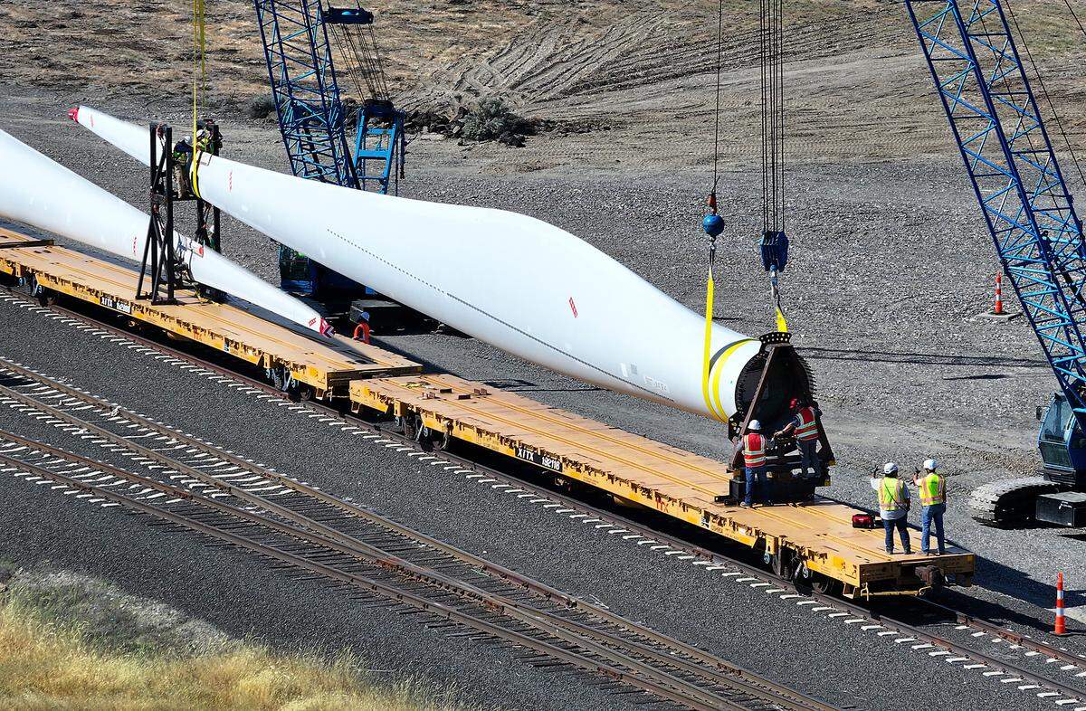 A Wyoming company that hauls oversize loads, including the wind turbine blades, is using the Port of Pasco as a staging ground. Workers began Thursday rigging straps around the blades and to lift them off train cars.