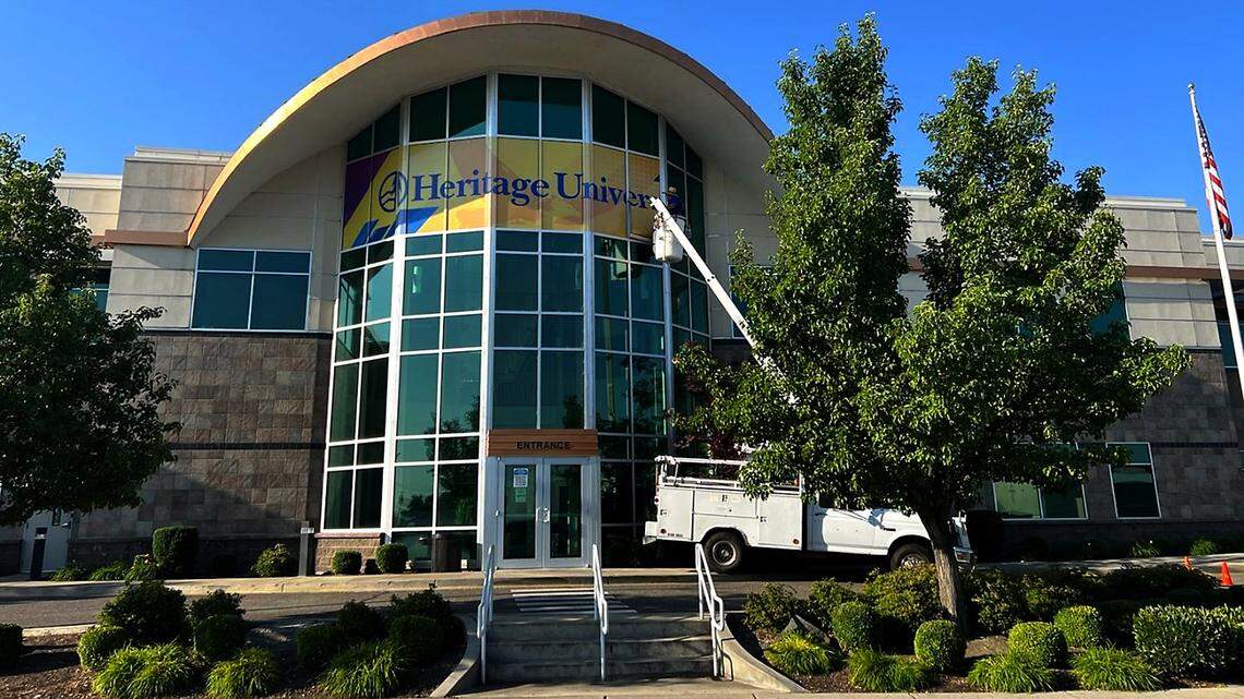 A new sign goes up of the Heritage University’s new downtown Kennewick location in the former Tri-City Herald building at 333 W. Canal Dr.