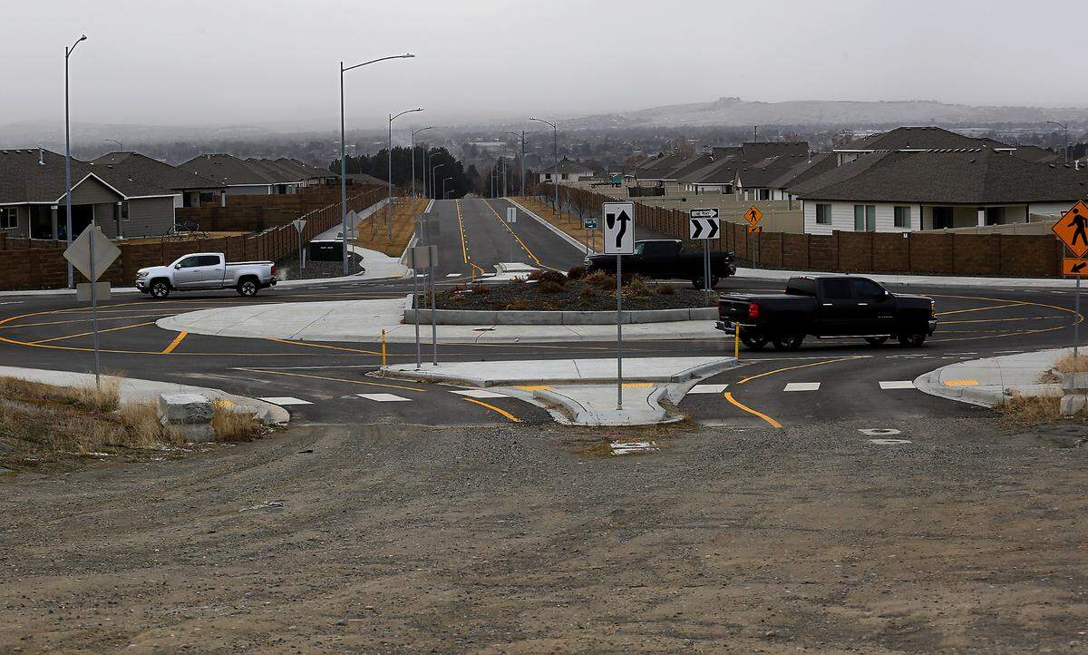 This view shows the roundabout on Road 76 and Chapel Hill Boulevard looking south, where is ends at a dirt field.