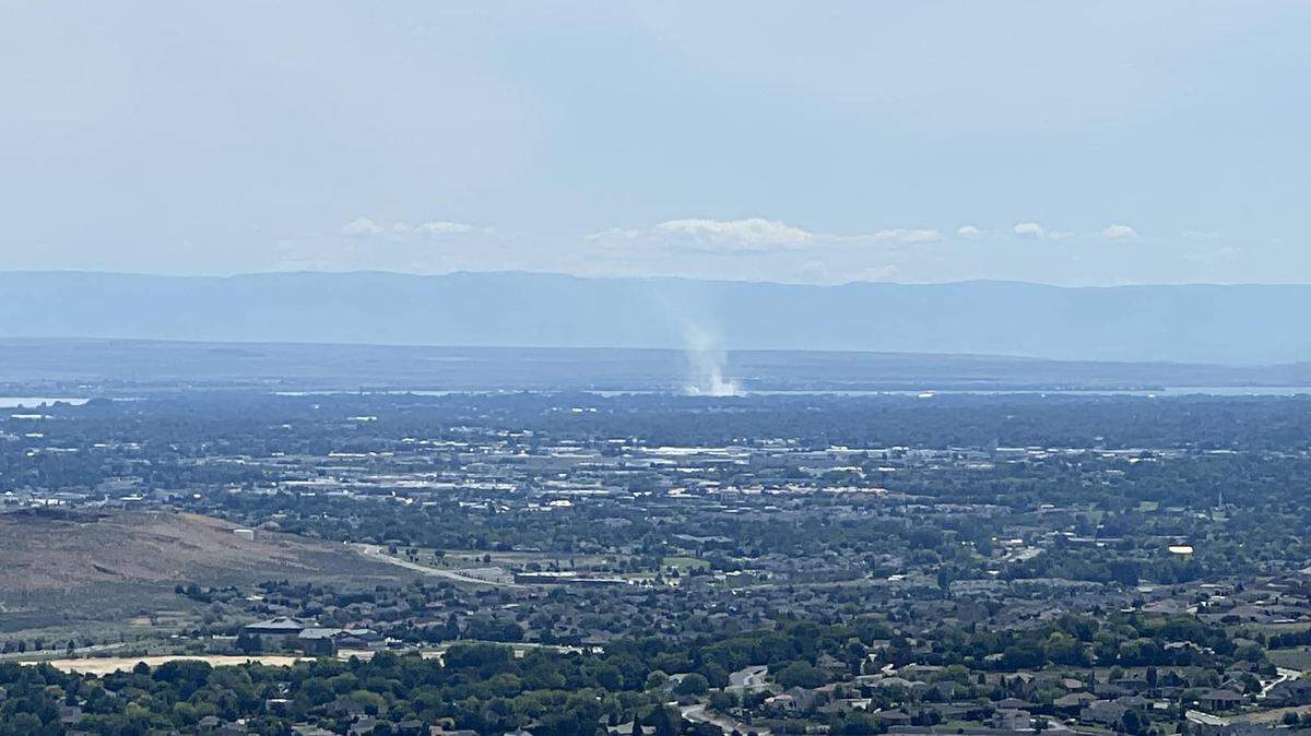 Smoke from the Lineage cold storage fire could be seen on Sunday from the top of Candy Mountain west of Richland, Wash.