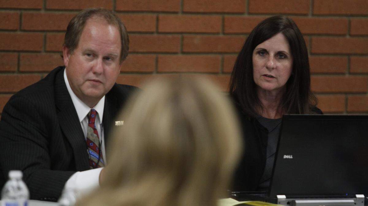 Marie Mosley, right, was hired as Kennewick city manager in January 2011. She’s shown at a city council workshop with Mayor Don Britain.