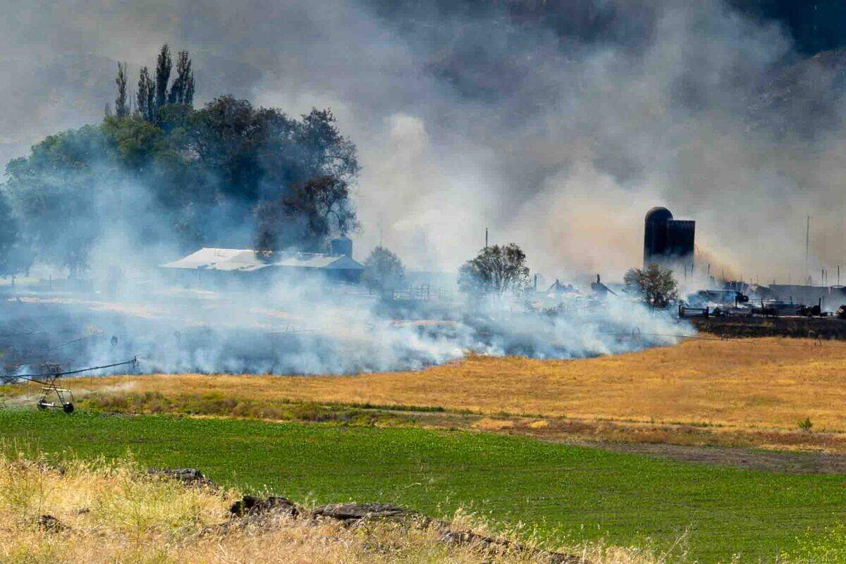A fire east of Benton City was forcing some residents to be evacuated as it burned near the Old Inland Empire Highway just north of Interstate 82 on Sunday.