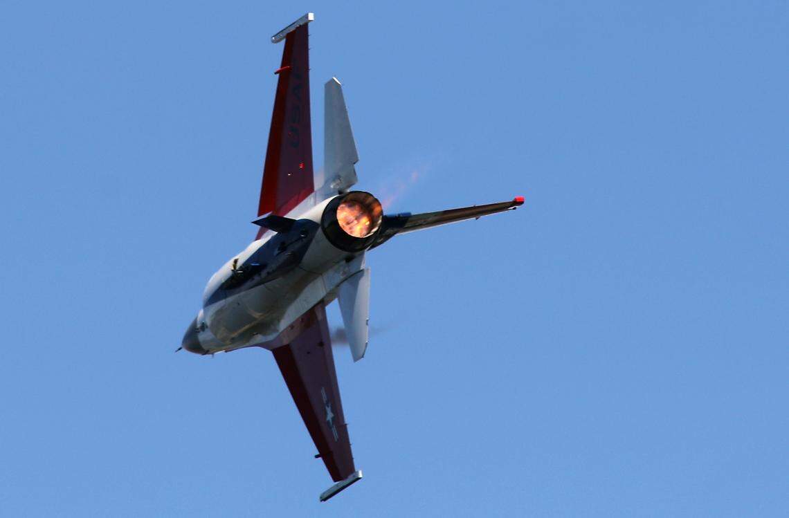 Flames belch from the engine's exhaust as Maj. Taylor Hiester uses the afterburner of the F-16 Viper fighter jet over the Columbia River July 27 during the Water Follies airshow performance in Kennewick.