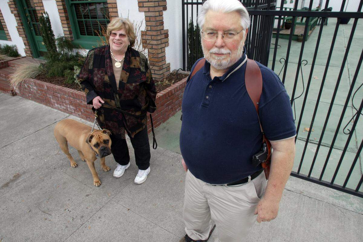 Duncan Dohmen, pictured with his wife Gail, was charged in Benton County District Court in 2009 with unlawfully displaying a gun. The open carry advocate had been reported by a manager at a McDonald’s in Prosser when he walked into the restaurant carrying his pistol in a shoulder holster.