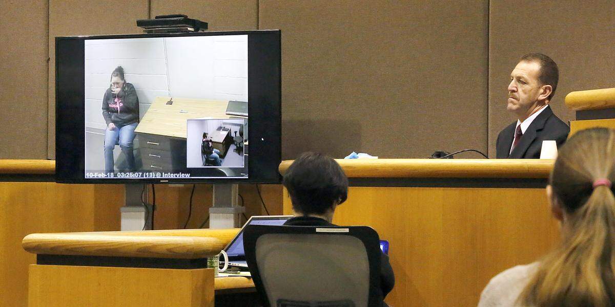 Murder supsect Amy S. Brown, far right, watches her emotional interview with Benton County sheriff’s investigators at her murder trial Wednesday in Benton County Superior Court. The recording was played as sheriff’s Detective Lee Cantu. Watch a video at: tricityherald.com/video