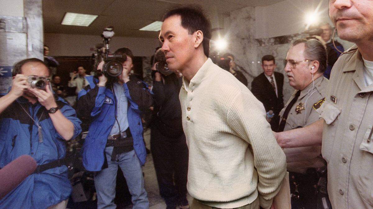 Martin Pang is taken into court to be sentenced after he pleaded guilty to four charges of manslaughter in 1998 for the deaths of four firefighters in a Seattle warehouse fire that he started.