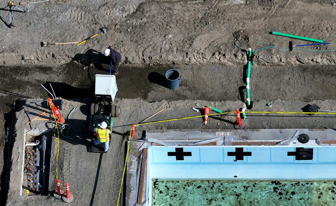 Crews from Walla Walla-based ESF Solutions are working on new foundation and deck at Pasco’s Memorial Pool for installation of a bubble cover.