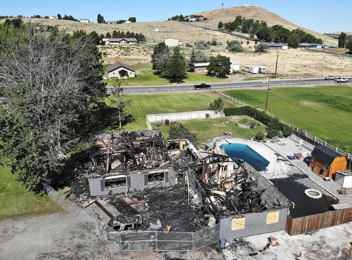A West Richland home on Everett Street was destroyed by fire on Sunday morning, but two young men and three dogs made it out of the burning house. Watch a video at: tricitiyherald.com/video