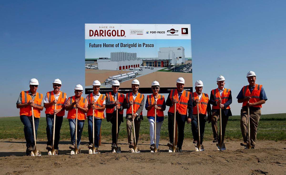 Darigold officals and local dignitaries take part in the ceremonial ground breaking for the news Darigold dairy production facility off North Railroad Avenue in Pasco. The plant will have capacity to process 8 million gallons of mild per day and employ about 200 people when fully operational.