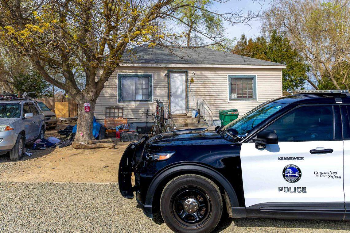 A woman was found dead after cooking in a vehicle near this home in Kennewick.