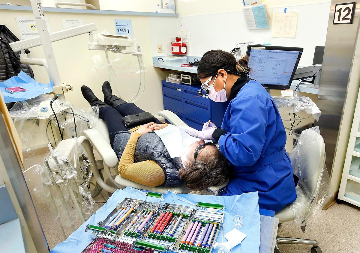 CBC student Victoria Martinez checks the teeth of patient Julia Pineda recently at the Dental Hygiene Clinic on the Pasco campus of the community college. Watch a video at: tricityherald.com/video