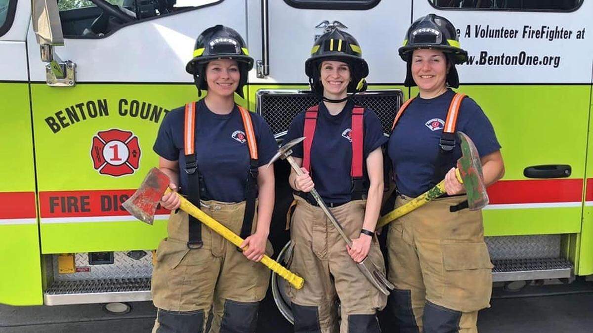 Firefighter/paramedic Samantha Ward, left, shown here in June 2020, is suing Benton County Fire District 1 for discrimination.